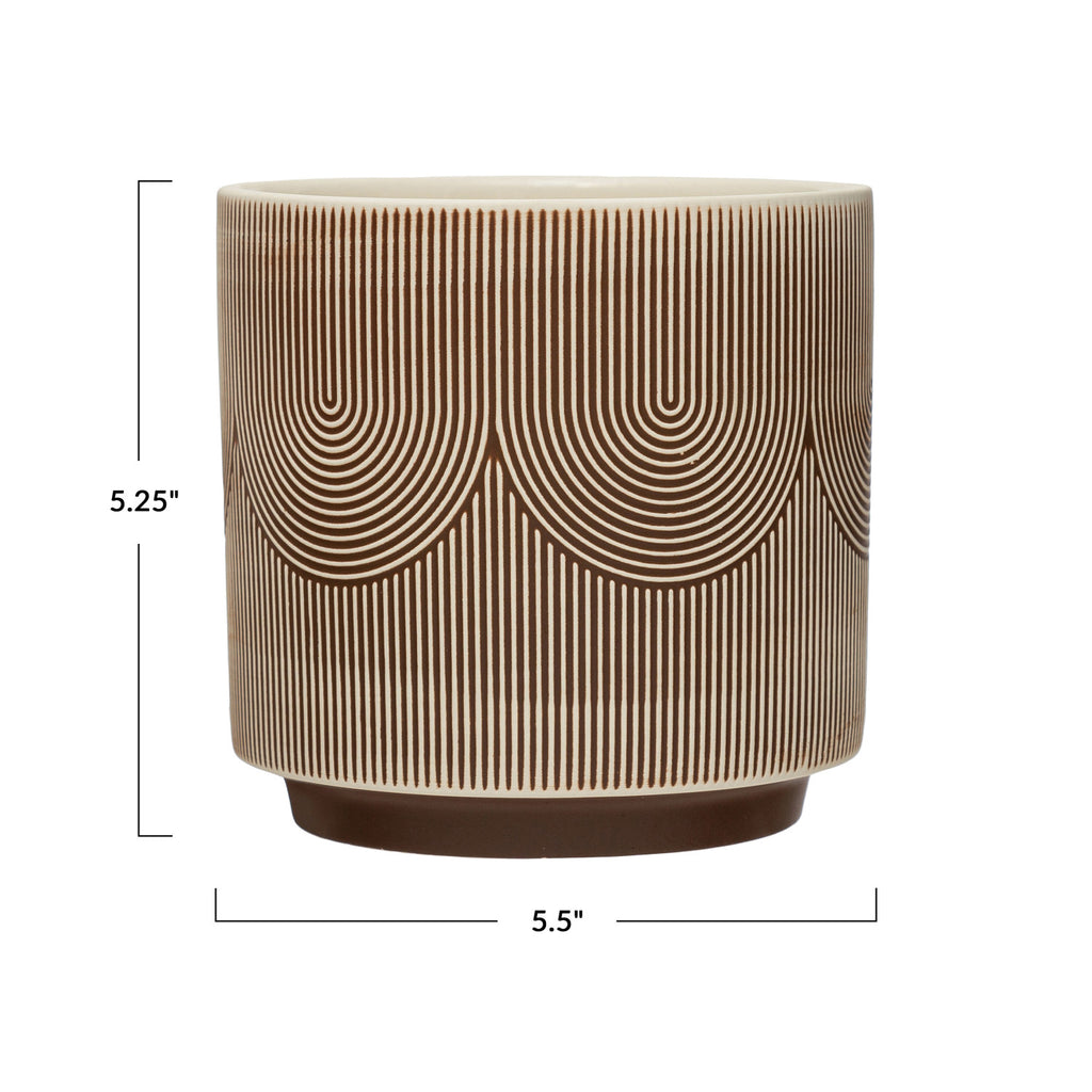 textured stoneware planter with linework in brown and cream curves, brown base and cream interior