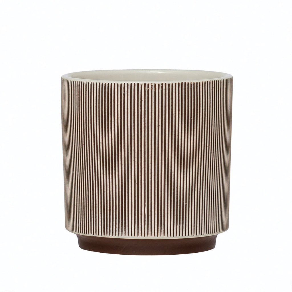 textured stoneware planter with linework in brown and cream lines, brown base and cream interior