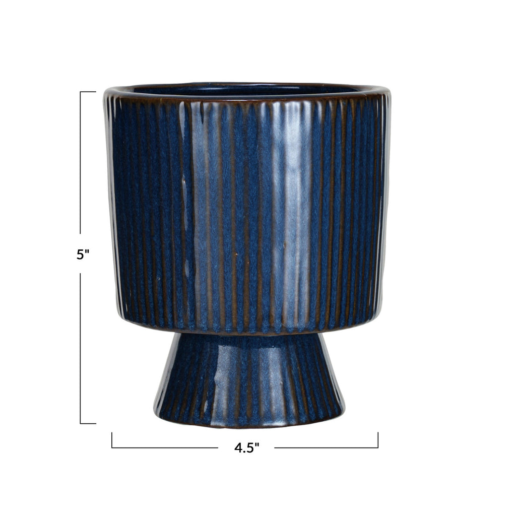Dark blue glazed fluted planter with pedestal and brown undercolor and dimensions 4.5in x 5in.