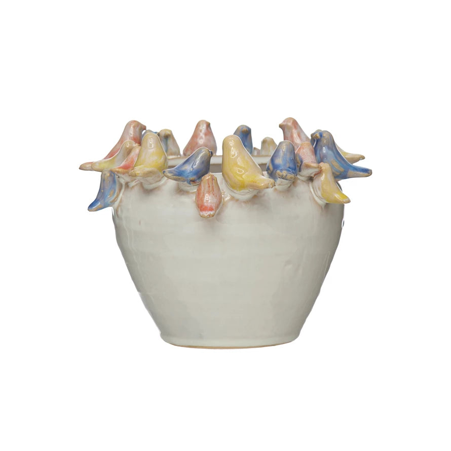 White Stoneware Planter with pink, blue, and yellow Birds on Rim on white background
