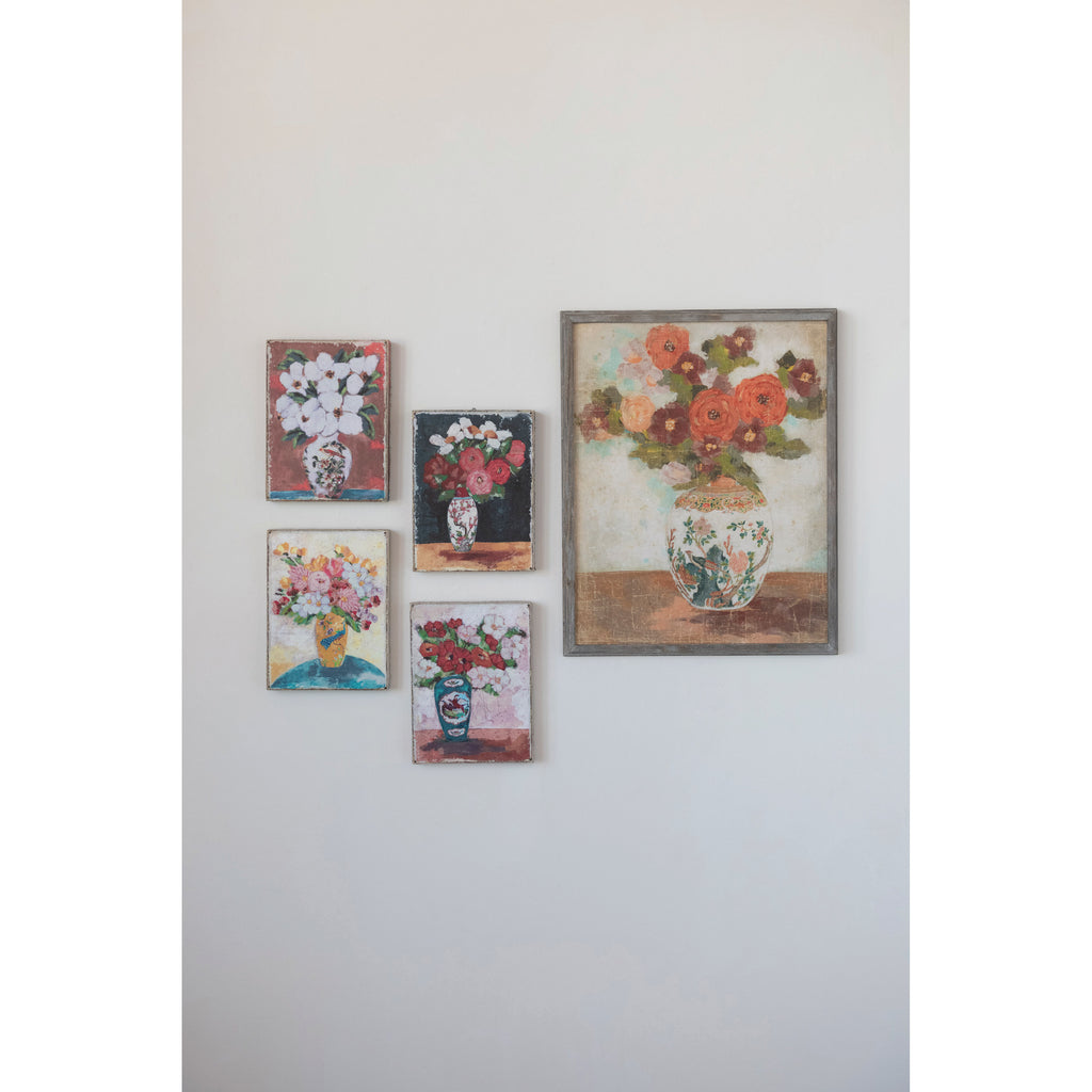 Framed abstract flower arrangement prints in muted colors.