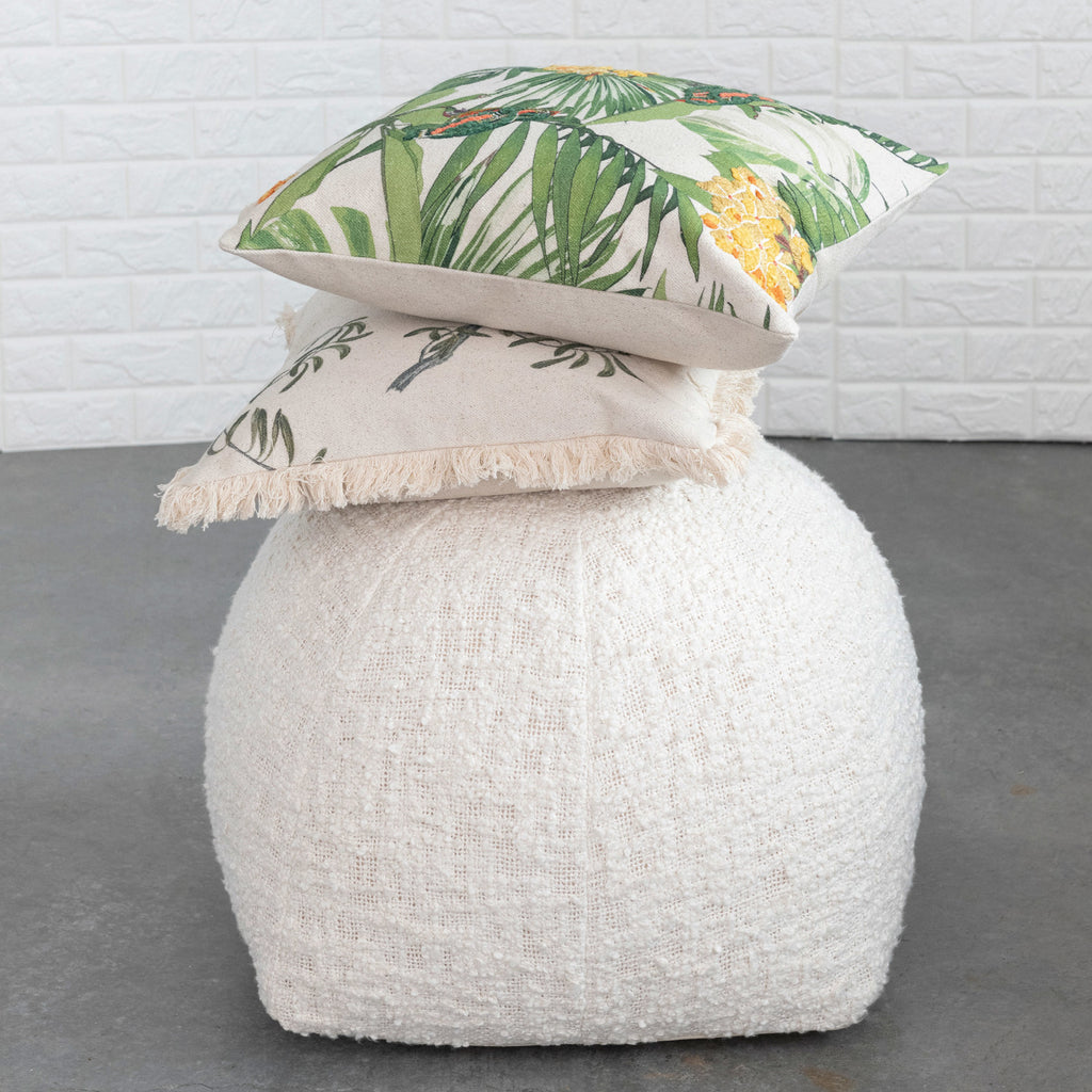 20in Bird & Palm Pillow on top of white fluffy cushion.