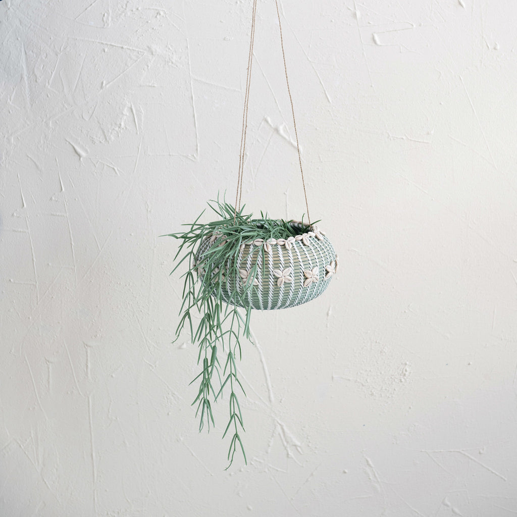 9in Aqua Hanging Hand-Woven Rattan Basket w/ Shells and hoya linearis on white background