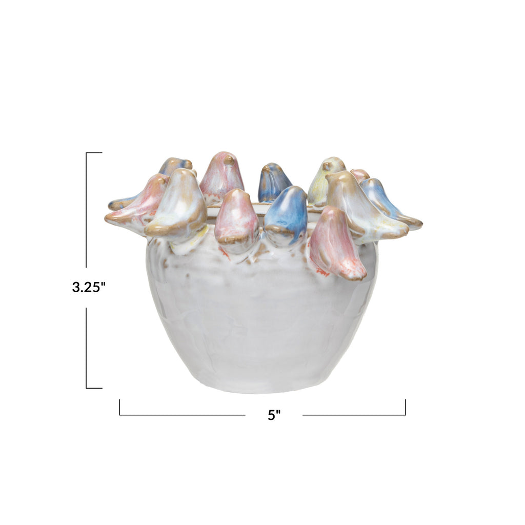 White Stoneware small Planter with pink, blue, and yellow Birds on Rim and peperomia plant inside on white background and dimensions 3.25in x 5in.