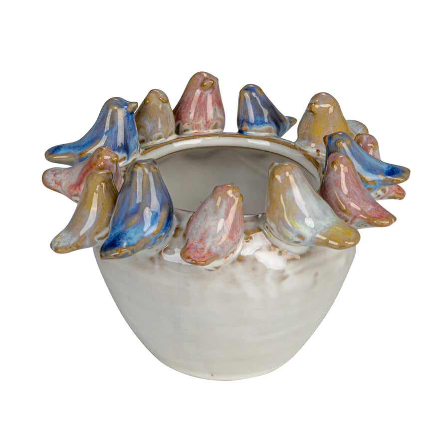 White Stoneware Planter with pink, blue, and yellow Birds on Rim on white background