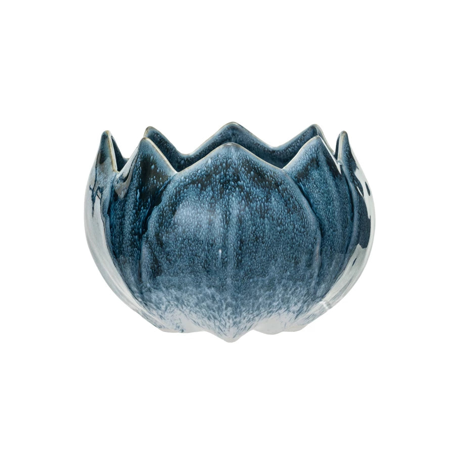 deep blue glazed flower shaped pot on white background