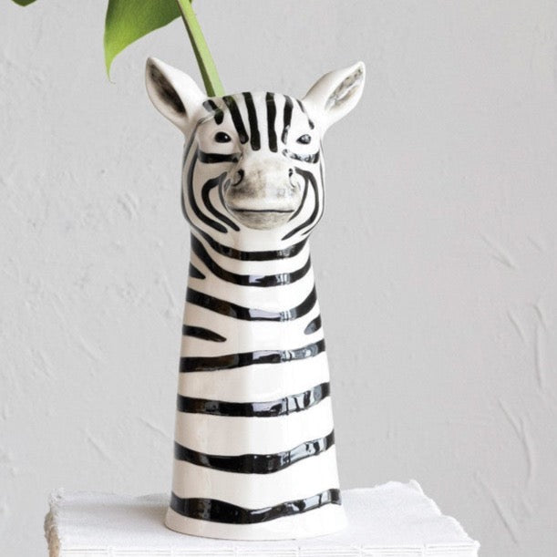 Zebra Hand-Painted Stoneware Vase shown with green leaf inside