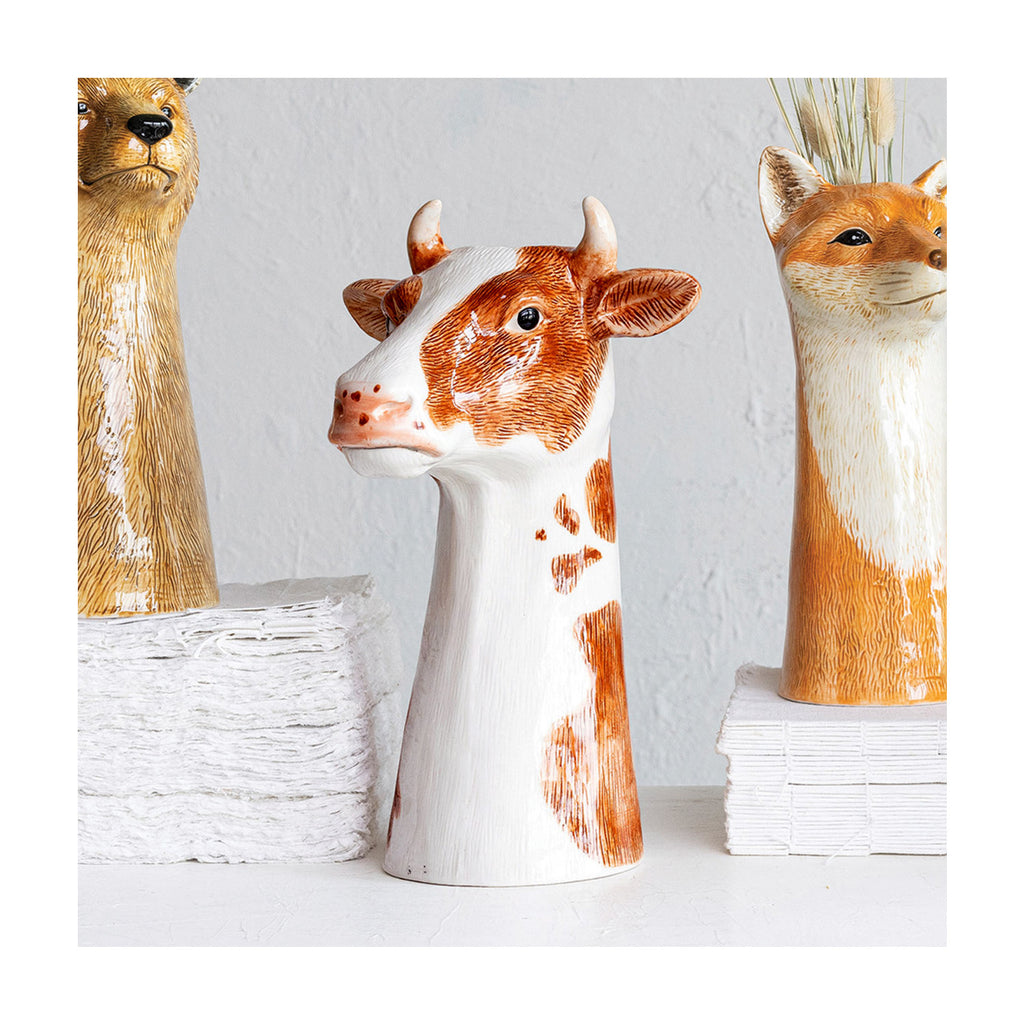 Hand-Painted Stoneware Cow Vase with bear and fox in background.