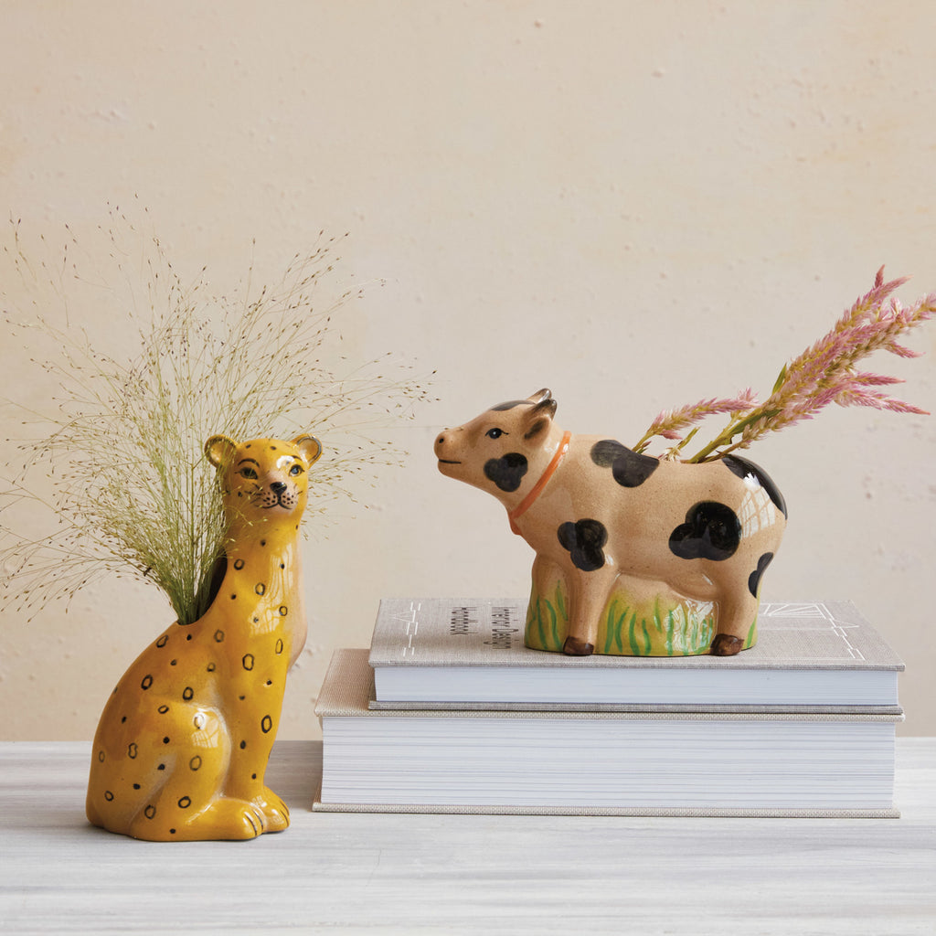 Hand-Painted Stoneware Leopard Vase with Pig vase on books in background