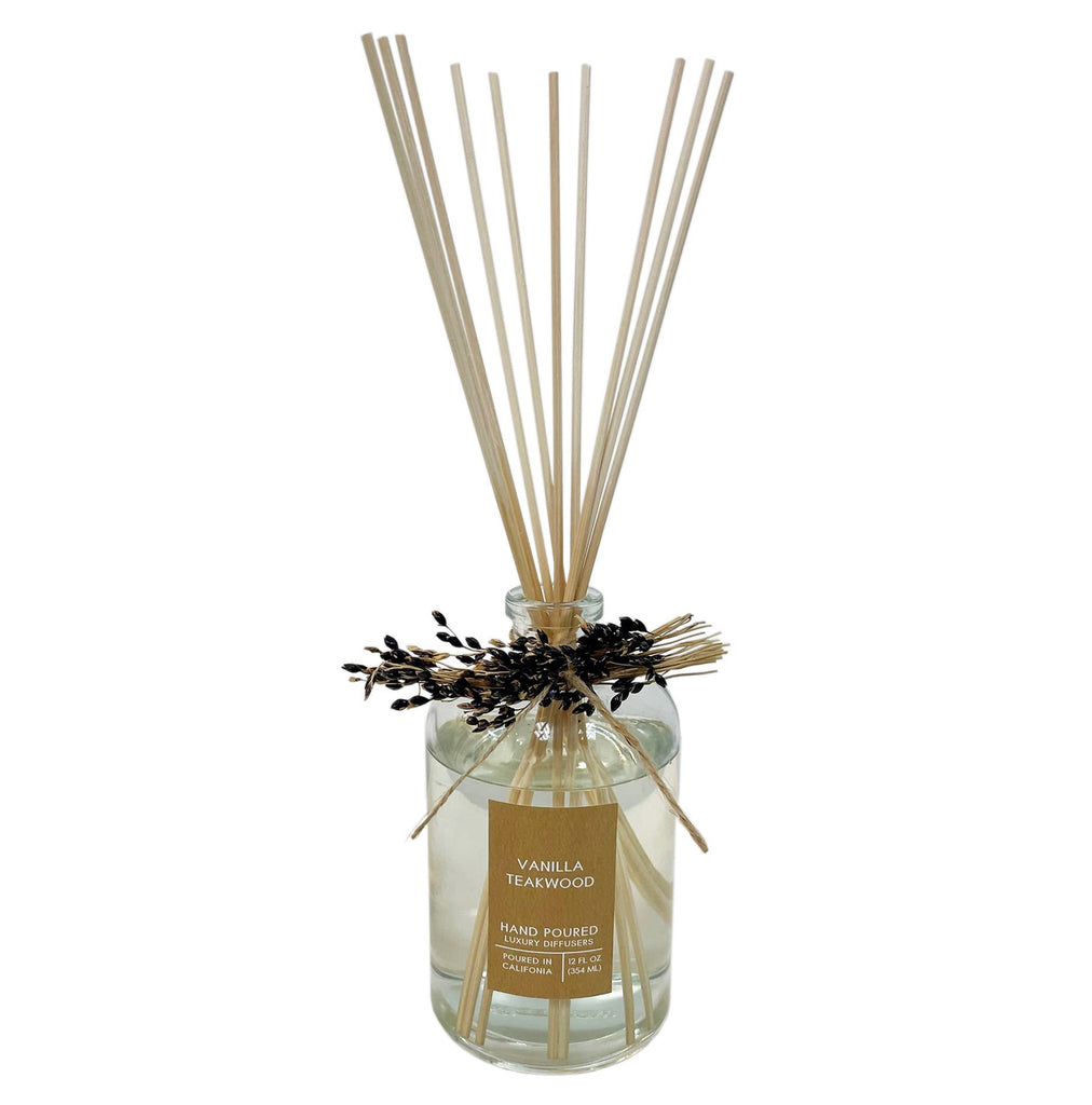 Vanilla Teakwood Botanical Tie Reed Diffuser with a sprig of black sorghum tied to the neck.
