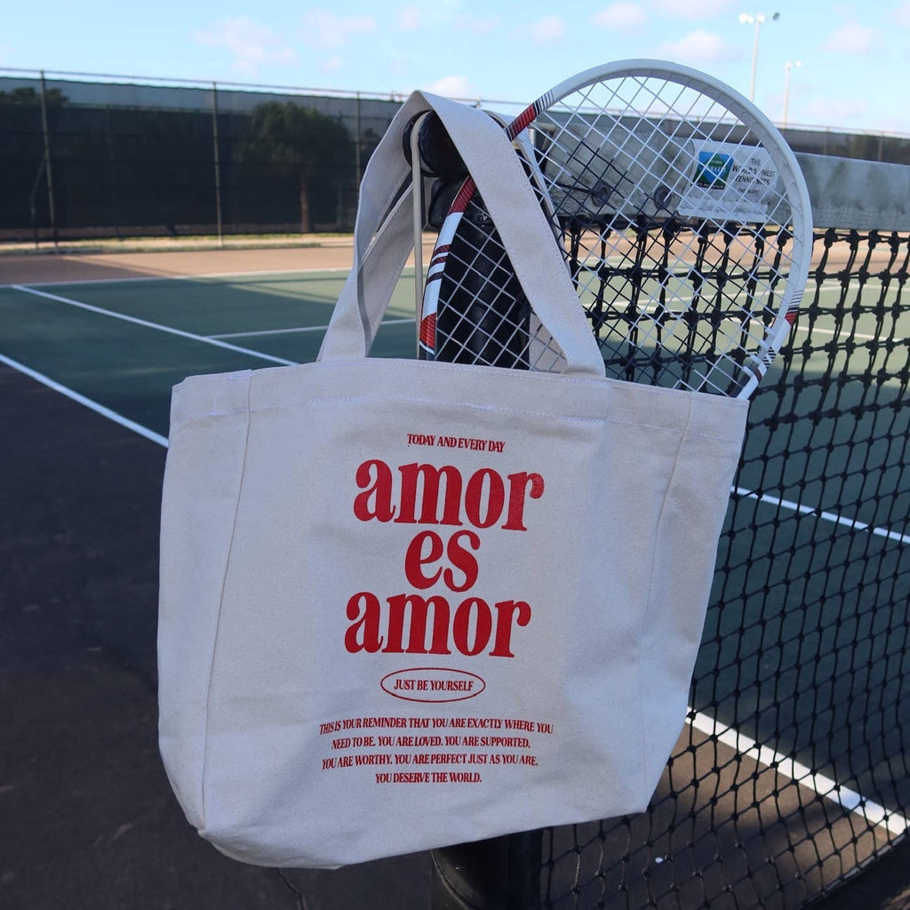 Amor es Amor tote bag with tennis racket inside.