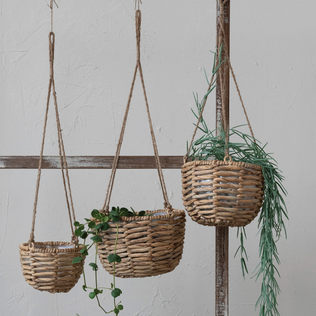 Hanging Hyacinth Planters w/ Plastic Liners & Jute Rope Hangers with plants inside hanging on wooden rack