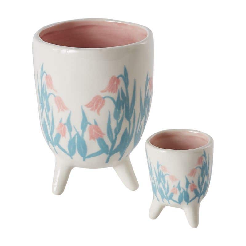 Floral Spring Footed Pot with blue leaves and pink flowers painted on.
