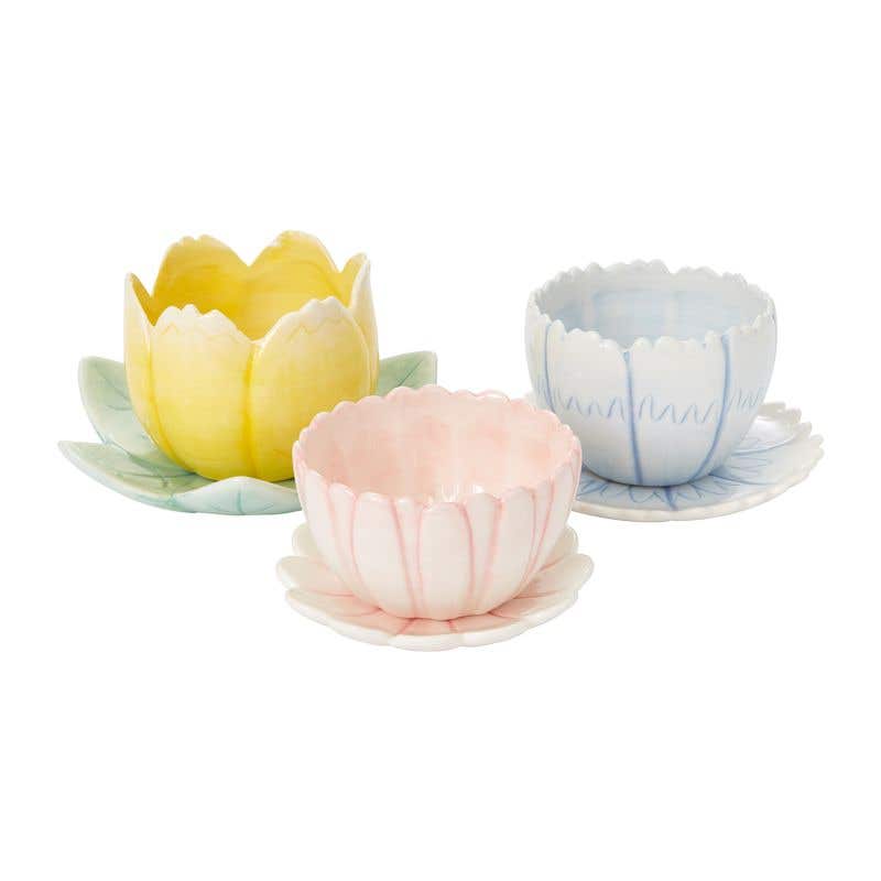 Flower shaped planters in pink, blue, and tulip yellow.